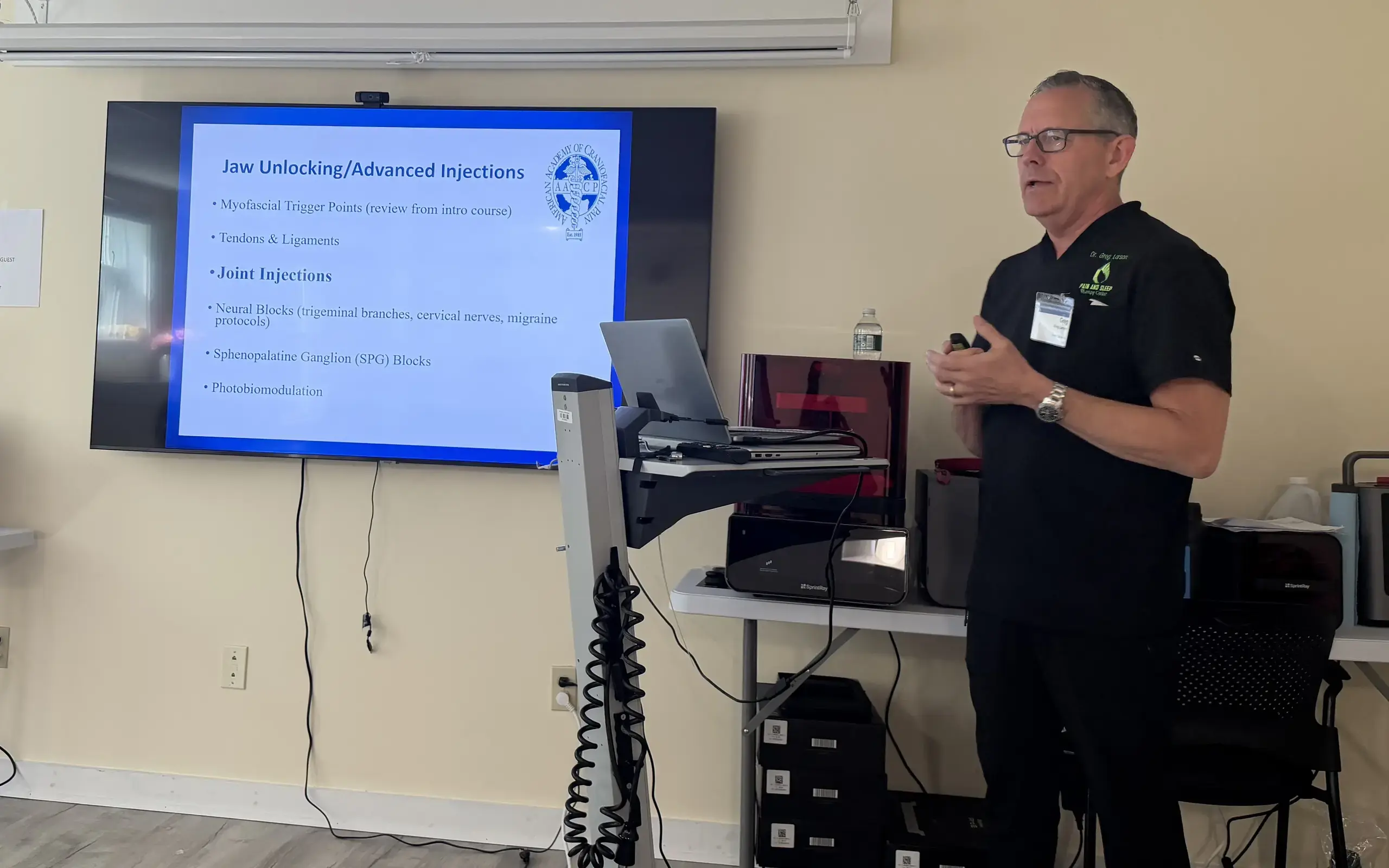 Dr. Greg Larson presenting advanced injection technique to visiting providers.