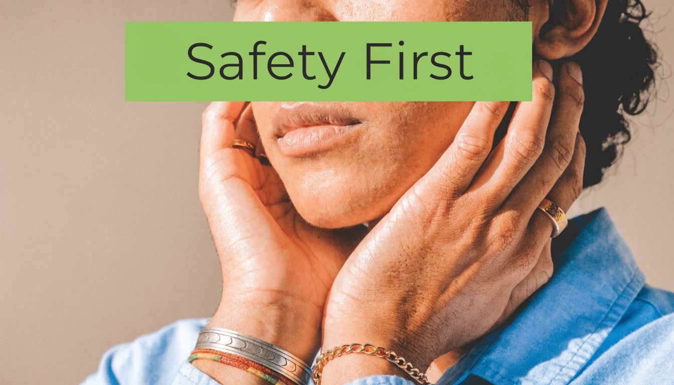 A close-up of a person with dark skin gently touching their jaw, promoting safety and health awareness.