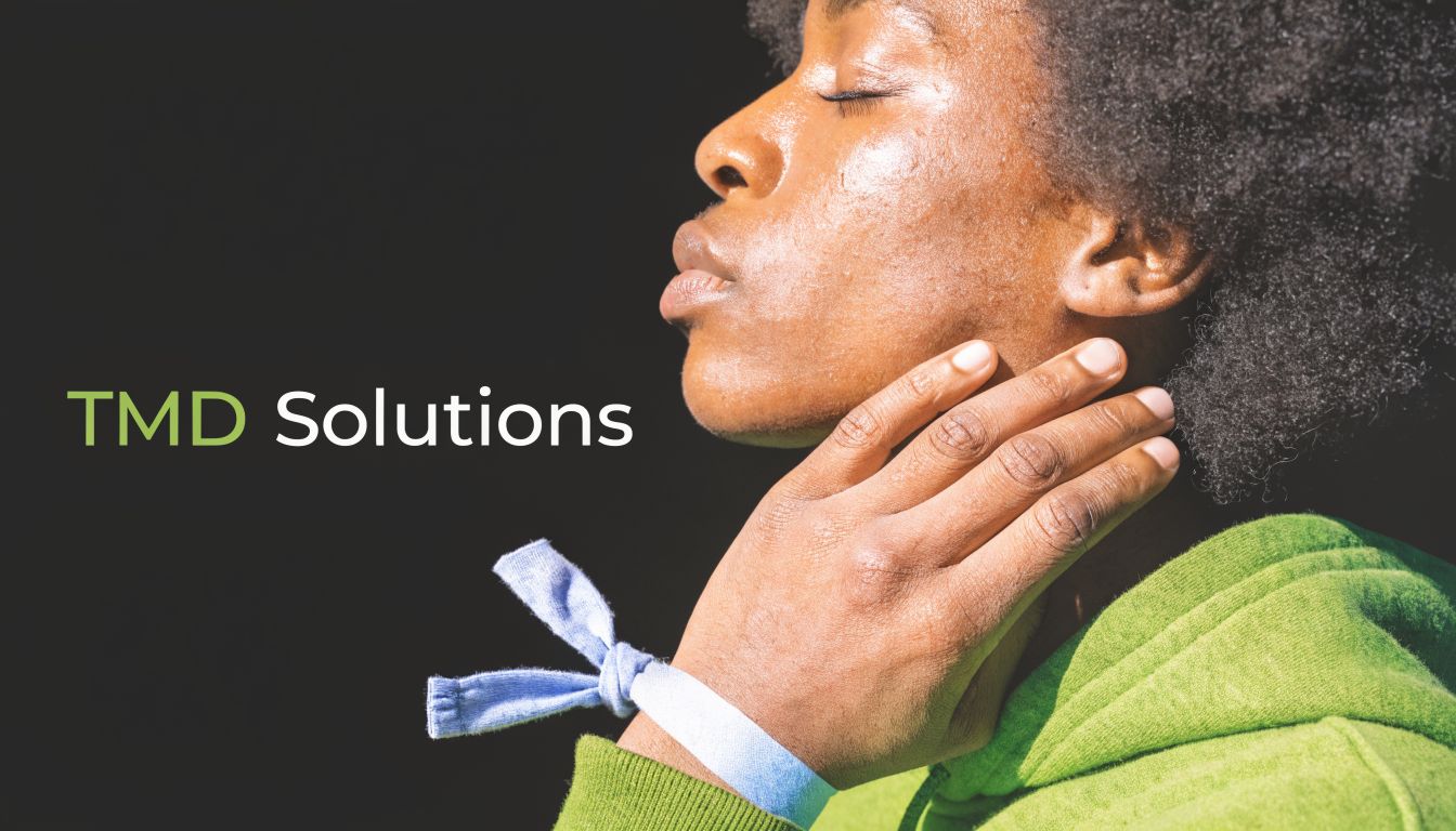 A person holding their jaw, reflecting on treatments for relief from TMD symptoms and orofacial pain.