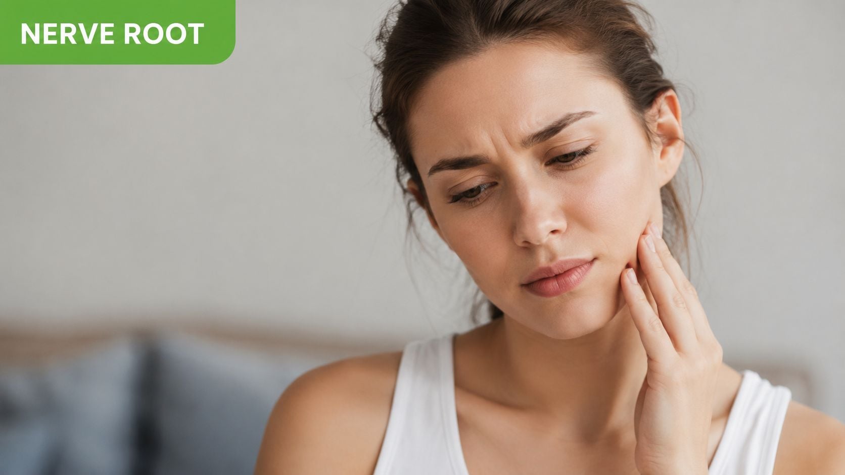 A woman holding her face in pain, expressing discomfort due to symptoms of jaw or nerve pain.